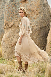 Model Tegan wearing size 10 of the Perfect As You Are Maxi Dress in colour Sand, from the front, showing the whole outfit