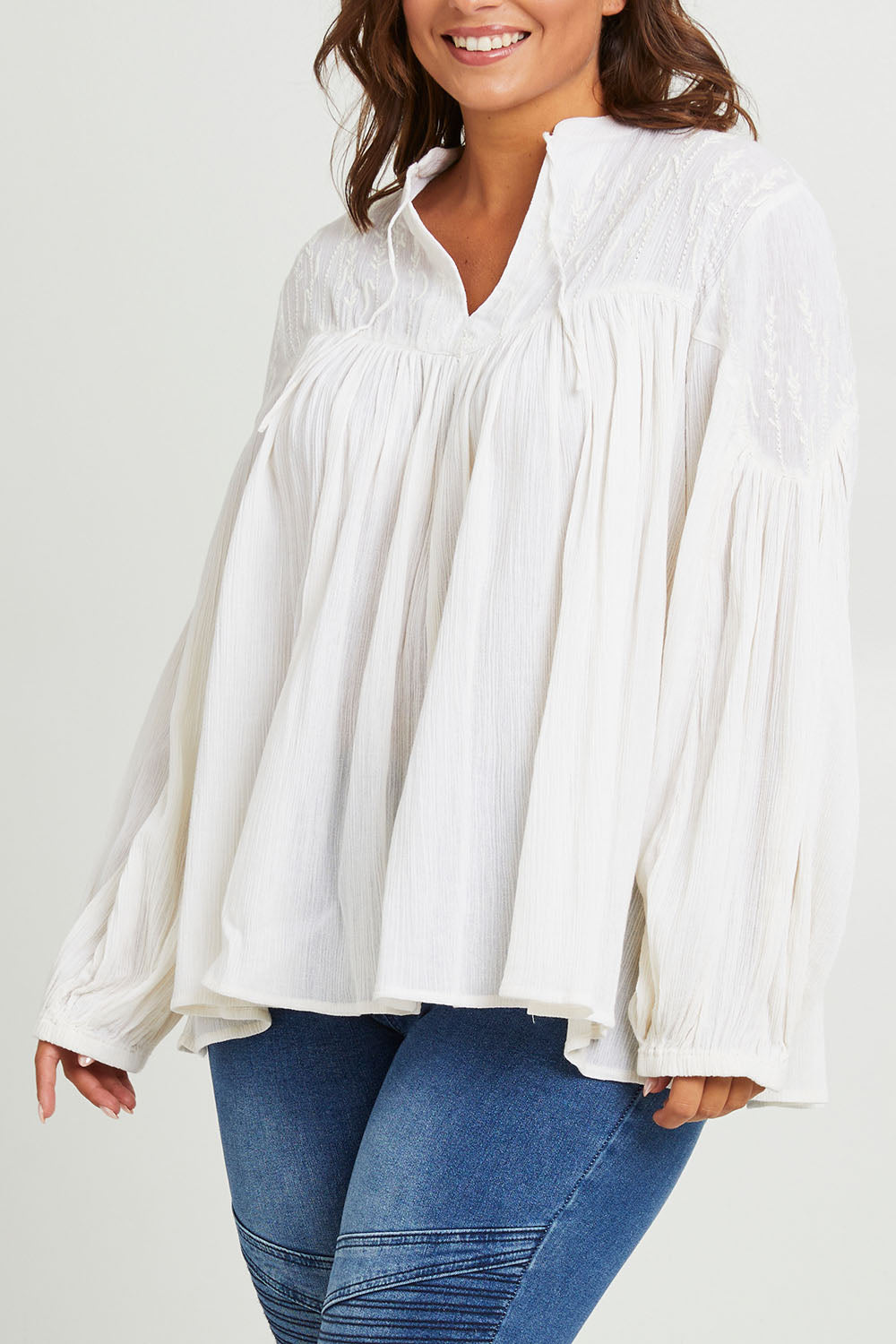 Model Monique wearing size 14 of the Fabulous Flouncy Cotton Blouse in colour Cream (White), from the front, cropped image
