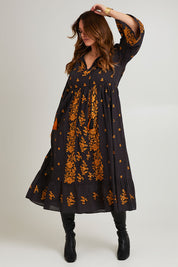 Model Laura wearing size 14 of the Dancing With Joy Dress in colour Black (Black), from the front, showing the whole outfit