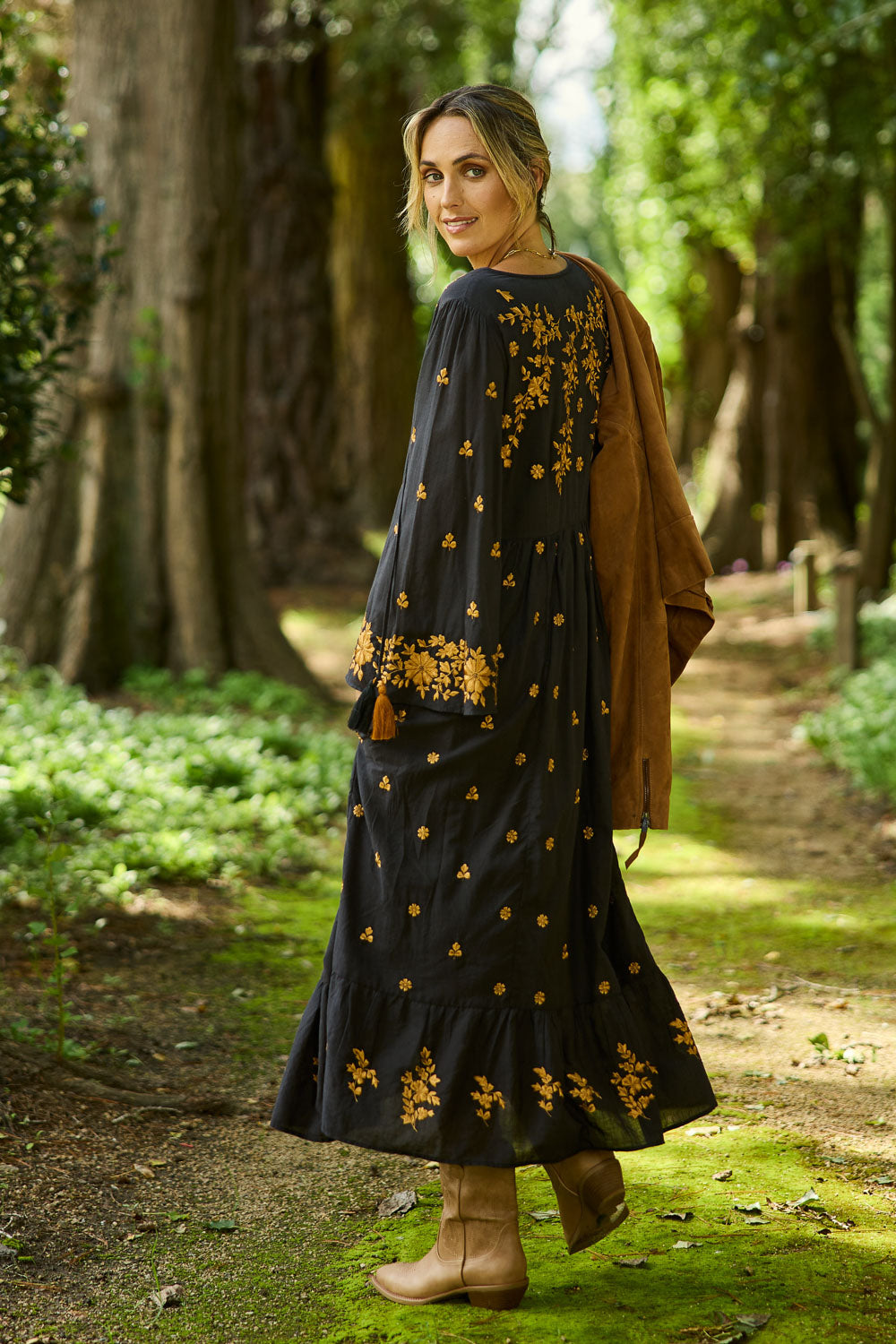 Model Tegan wearing size 10 of the Dancing With Joy Dress in colour Black (Black), from the front, showing the whole outfit