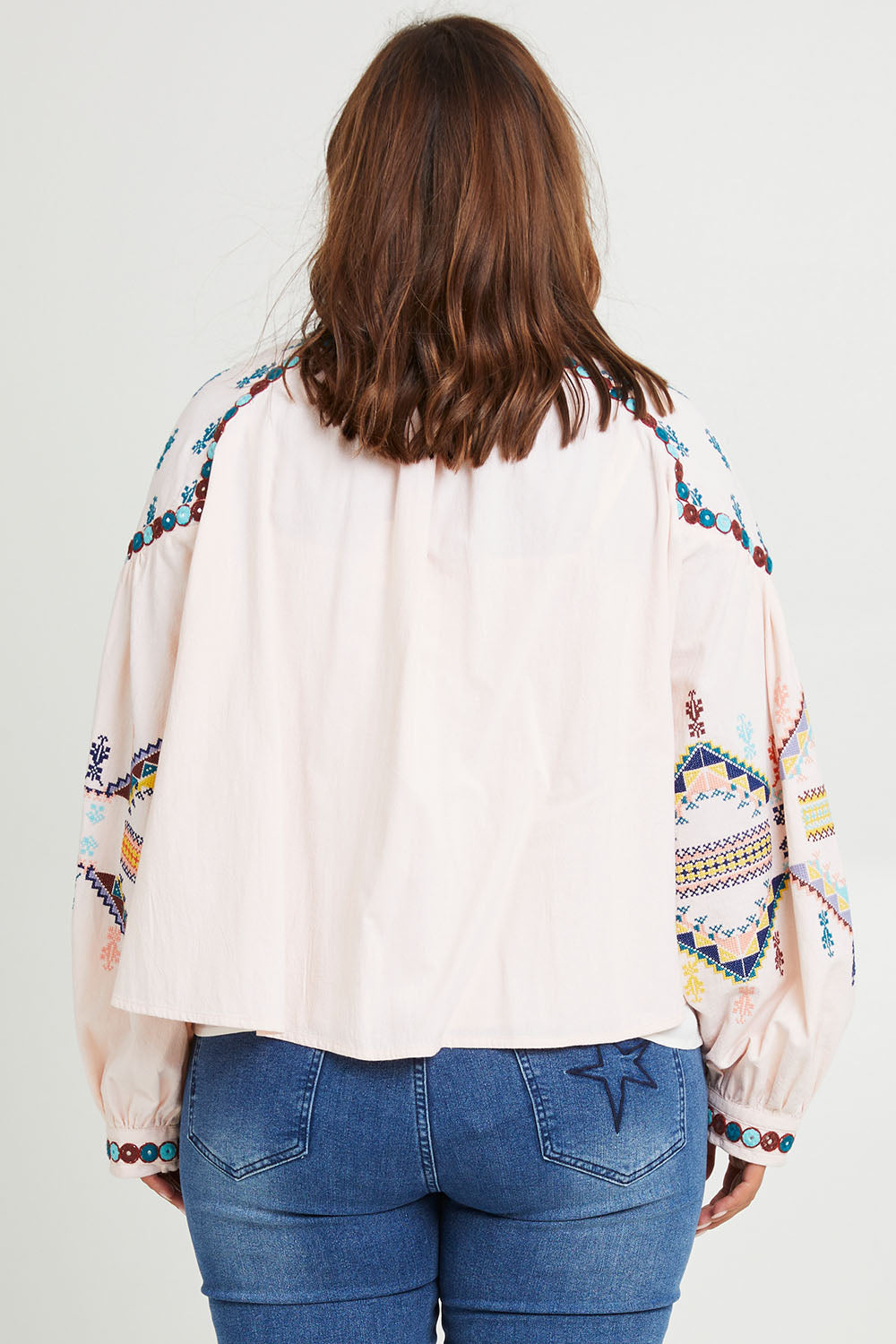 Model Monique wearing size 14 of the Joyous Feeling Jacket in colour Palepink (Pink), from the back