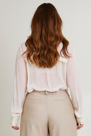 Model Laura wearing size 14 of the Lady Love Blouse in colour Milk (White), from the back