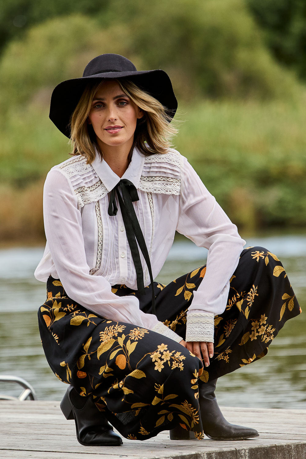 Model Tegan wearing size 10 of the Lady Love Blouse in colour Milk (White), from the front, showing the whole outfit
