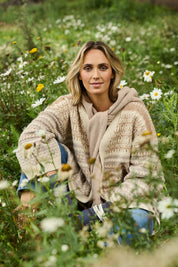 Model Tegan wearing size S of the Mountain Dreaming Oversized Cardi in colour Naturals, from the front, showing the whole outfit