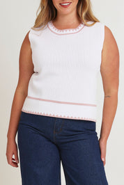Model Chanel wearing size XL of the Always Classic Knit Tank in colour Milkrose, from the front, cropped image
