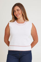 Model Chanel wearing size XL of the Always Classic Knit Tank in colour Milkrose, from the front, cropped image