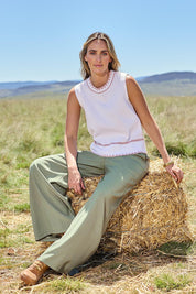 Model Tegan wearing size S of the Always Classic Knit Tank in colour Milkrose, from the front, showing the whole outfit
