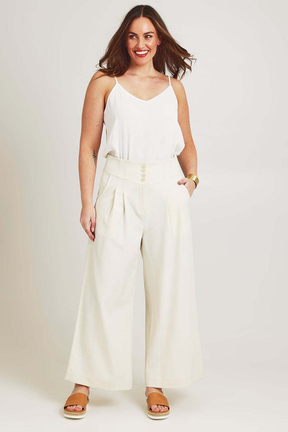 Model Jane wearing size 14 of the High Flying Wide Leg Pants in colour Cream, from the front, showing the whole outfit