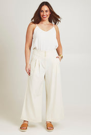 Model Jane wearing size 14 of the High Flying Wide Leg Pants in colour Cream, from the front, showing the whole outfit