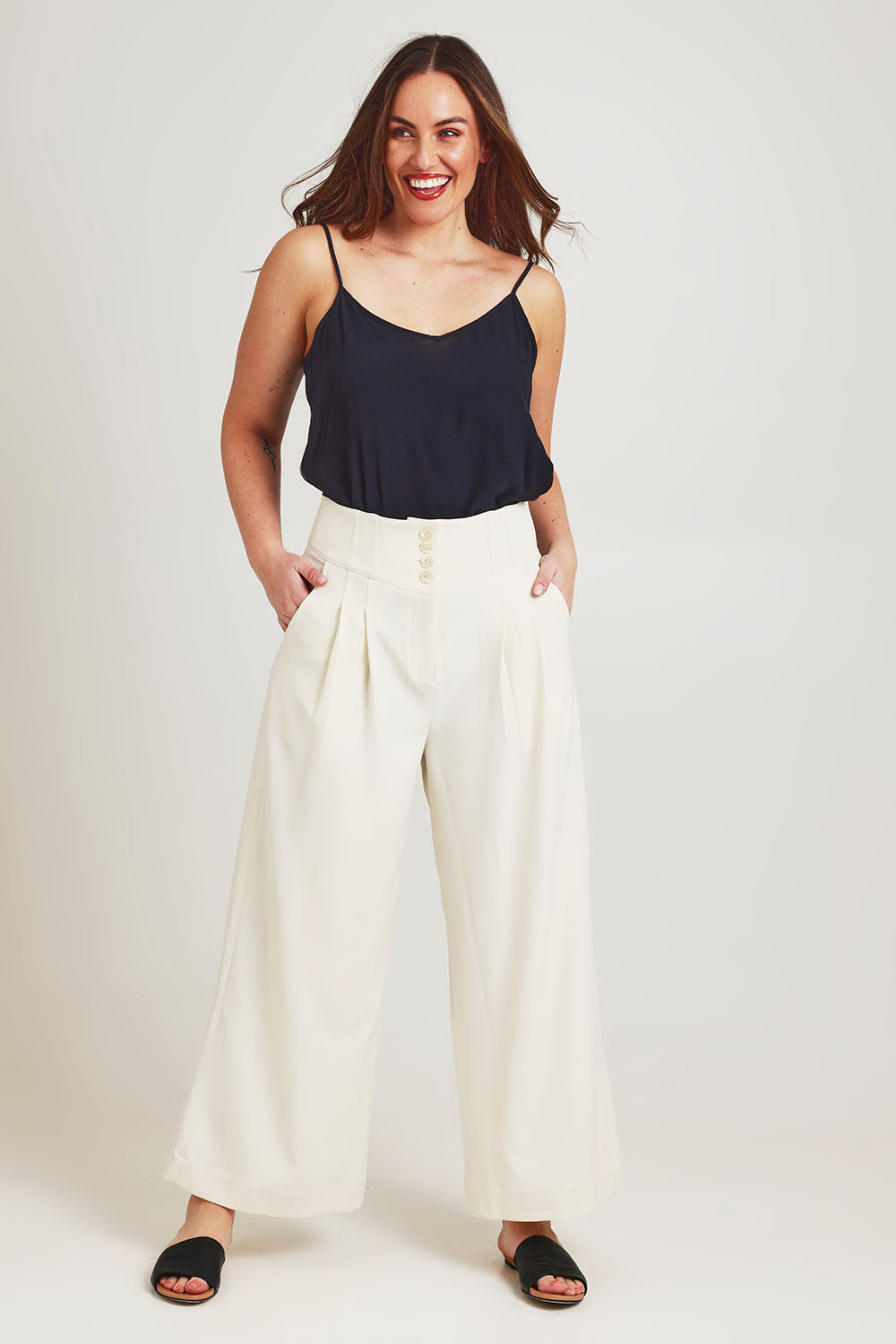 Model Jane wearing size 14 of the High Flying Wide Leg Pants in colour Cream, from the front, showing the whole outfit