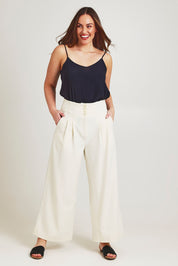 Model Jane wearing size 14 of the High Flying Wide Leg Pants in colour Cream, from the front, showing the whole outfit