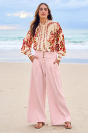 Model Tegan wearing size 10 of the High Flying Wide Leg Pants in colour Palepink (Pink), from the front, showing the whole outfit