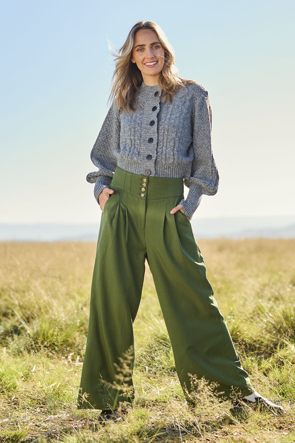 Model Tegan wearing size 10 of the High Flying Wide Leg Pants in colour Pine (Green), from the front, showing the whole outfit