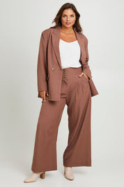 Model Monique wearing size 14 of the High Flying Oversized Blazer in colour Walnut, from the front, showing the whole outfit