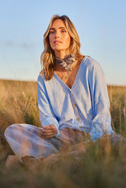 Model Tegan wearing size S of the My Boyfriends Cotton Cashmere Cardi in colour Sky (Blue), from the front, showing the whole outfit