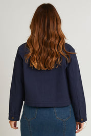 Model Laura wearing size 14 of the Coffee Date Jacket in colour Navy (Blue), from the back