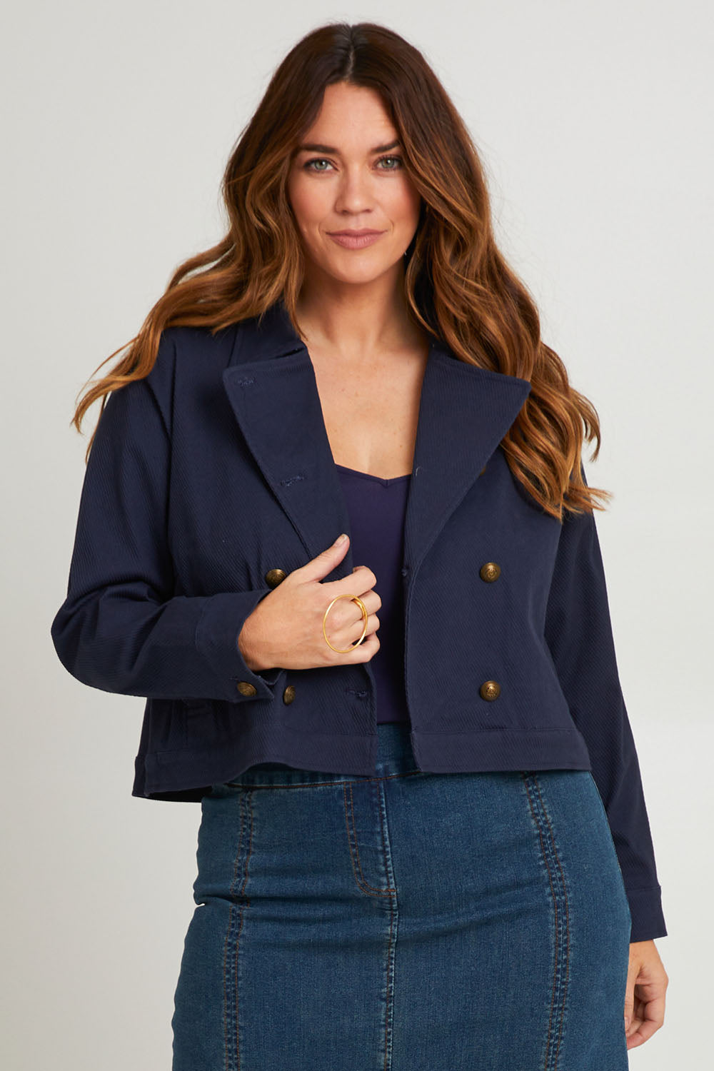 Model Laura wearing size 14 of the Coffee Date Jacket in colour Navy (Blue), from the front, cropped image