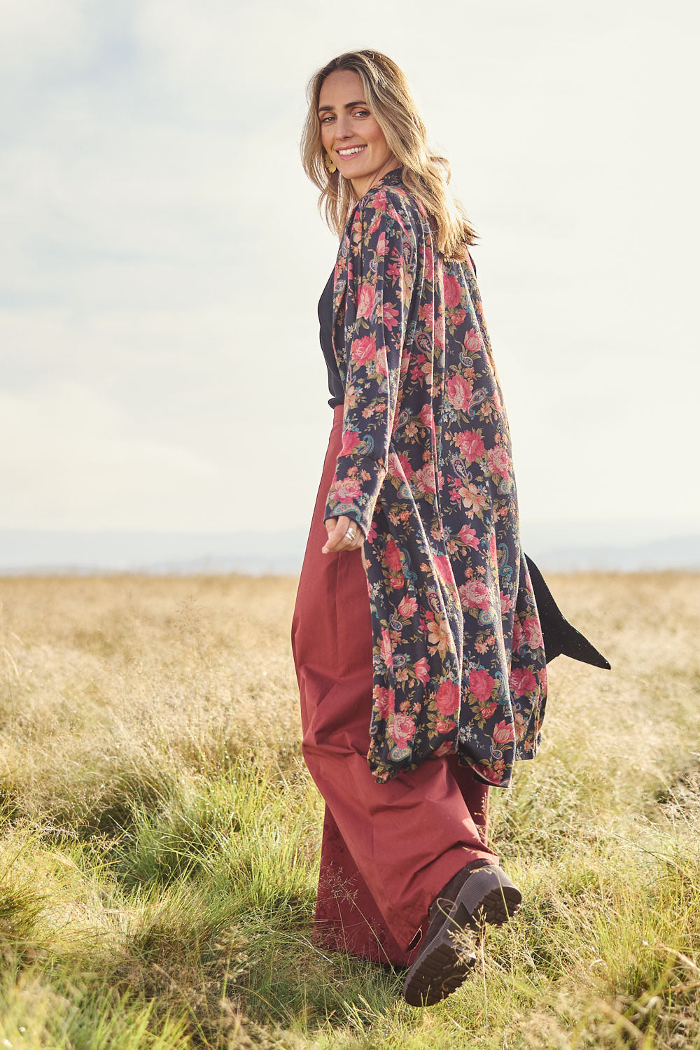 Model Tegan wearing size 10 of the Flowers For Me Cardigan in colour Blackrose (Black), from the front, showing the whole outfit