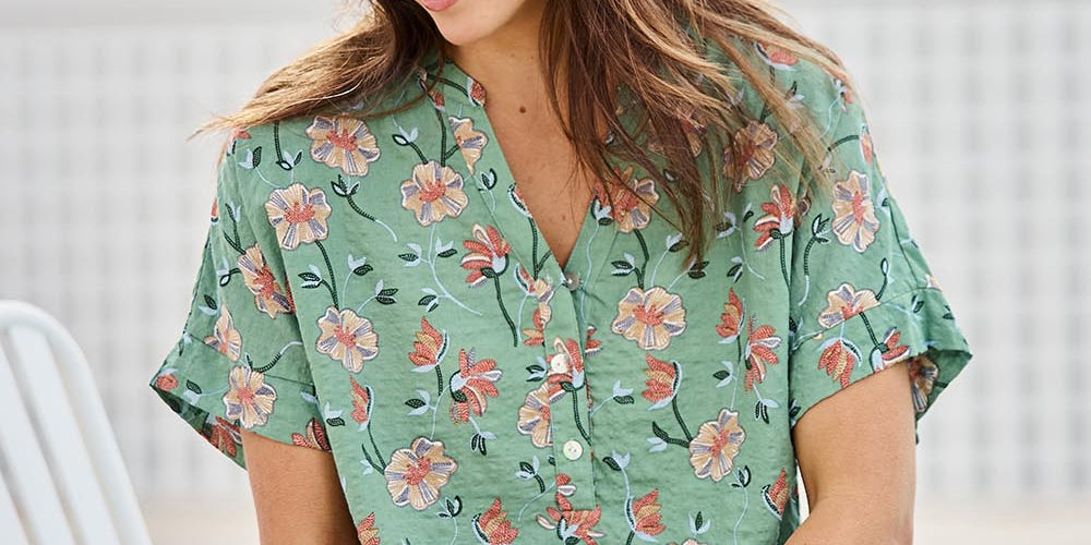 Model Tegand wearing size 10 of the Flower Chain Slouch Top – Leaf in colour Leaf, in a cropped view