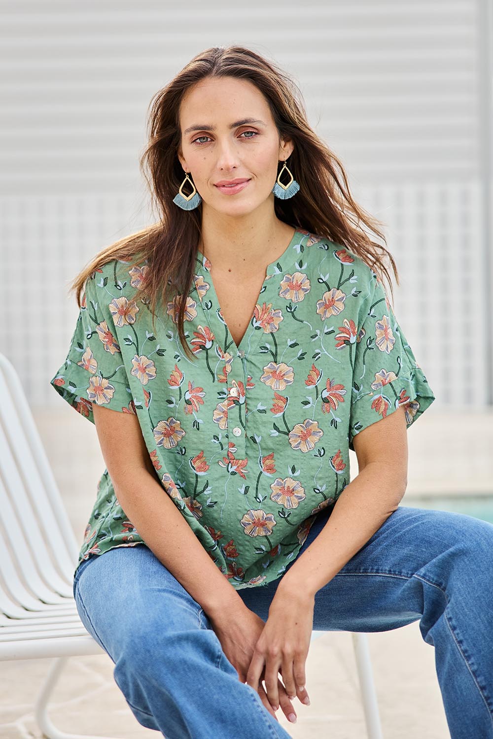 Model Tegand wearing size 10 of the Flower Chain Slouch Top – Leaf in colour Leaf, in a cropped view