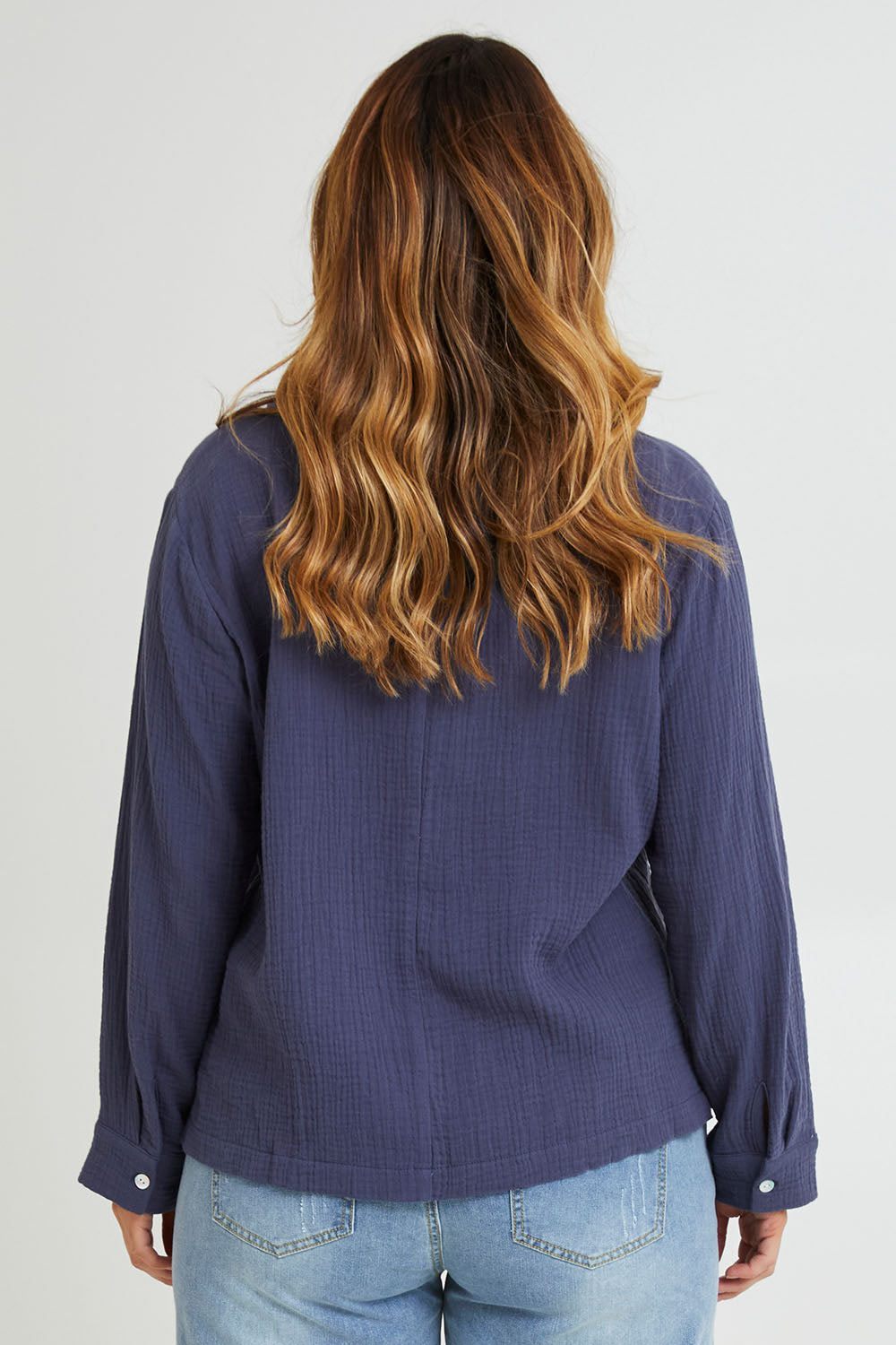 Model Laura wearing size 14 of the Grandpa And Me Cotton Blouse in colour Denim (Blue), from the back