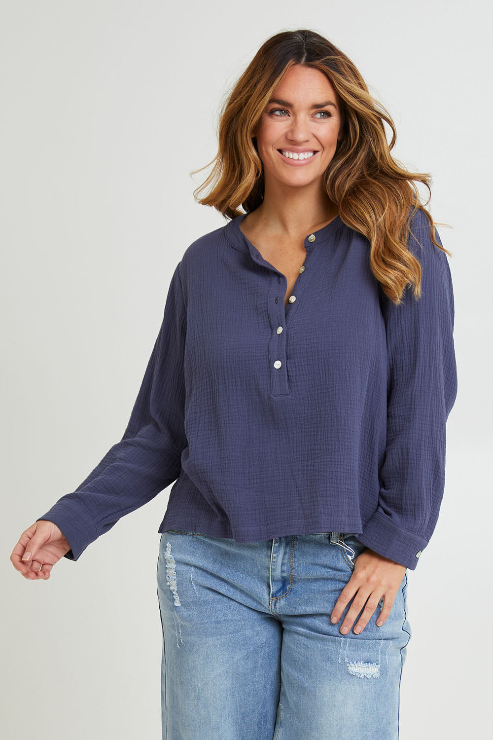 Model Laura wearing size 14 of the Grandpa And Me Cotton Blouse in colour Denim (Blue), from the front, cropped image