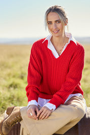 Model Tegan wearing size S of the Ready And Cable Jumper in colour Firecraker (Red), from the front, showing the whole outfit
