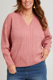 Model Laura wearing size L of the Ready And Cable Jumper in colour Petal (Pink), from the front, cropped image