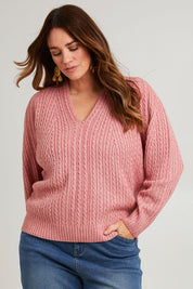 Model Laura wearing size L of the Ready And Cable Jumper in colour Petal (Pink), from the front, cropped image