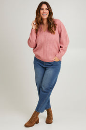 Model Laura wearing size L of the Ready And Cable Jumper in colour Petal (Pink), from the front, showing the whole outfit