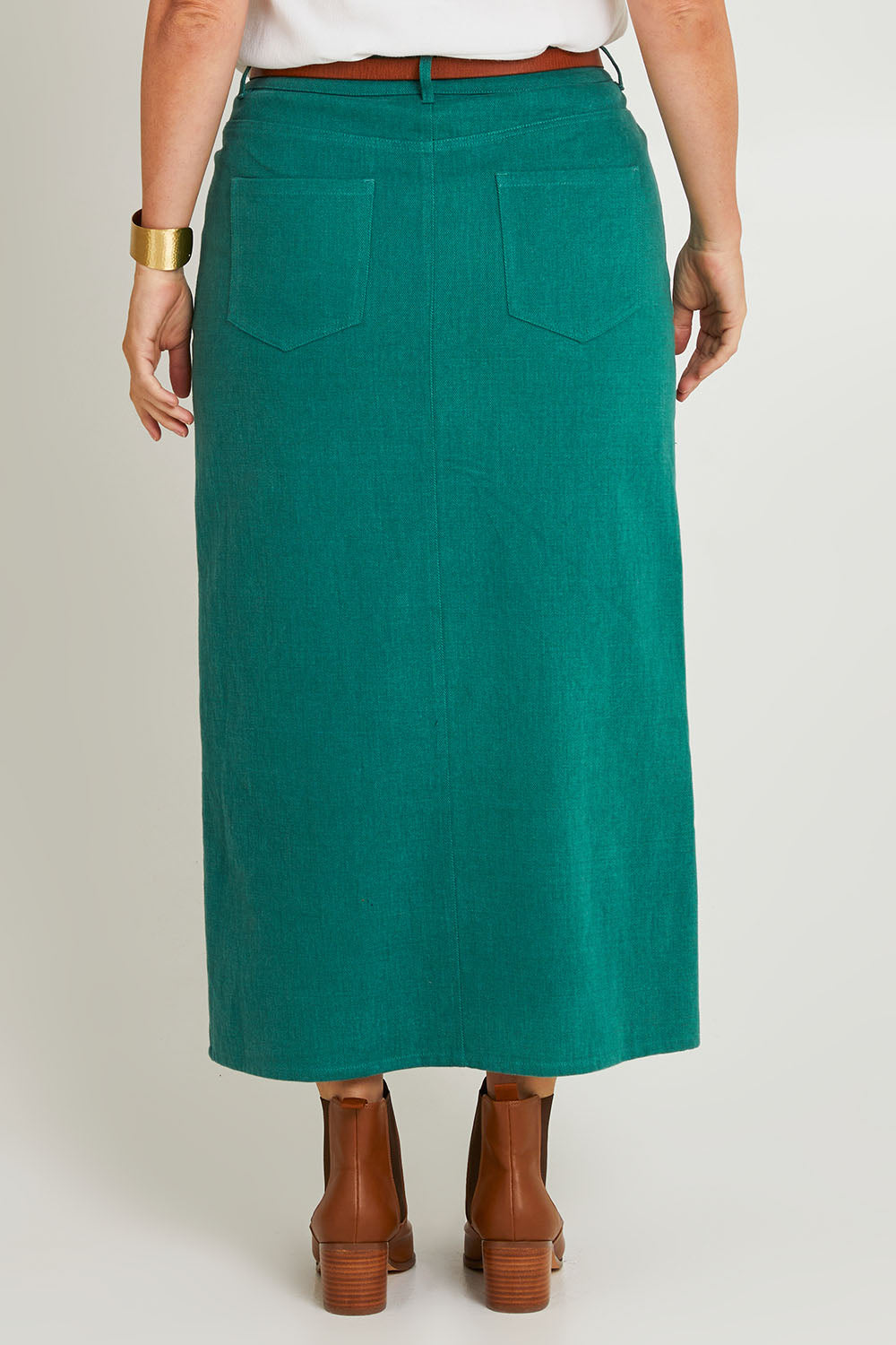Model Laura wearing size 14 of the Carry Me With You Maxi Skirt in colour Forest (Green), from the back