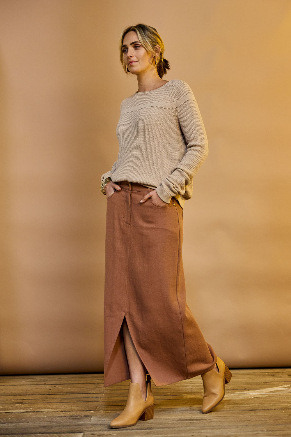 Model Tegan wearing size 10 of the Carry Me With You Maxi Skirt in colour Rosewood, from the front, showing the whole outfit