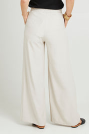 Model Luisa wearing size 10 of the Striding Out Wide Leg Pants in colour Moet, from the back