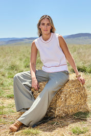 Model Tegan wearing size 10 of the Striding Out Wide Leg Pants in colour Thyme (Green), from the front, showing the whole outfit