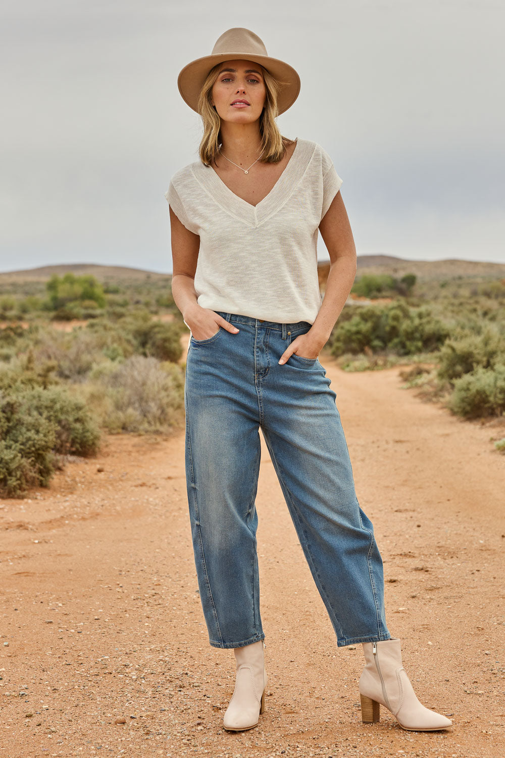 Model Tegan wearing size 10 of the For All The Days Jeans in colour Denim (Blue), from the front, showing the whole outfit