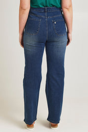 Model Jane wearing size 14 of the Pleased To Meet You Jeans in colour Denim (Blue), from the back