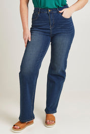 Model Jane wearing size 14 of the Pleased To Meet You Jeans in colour Denim (Blue), from the front, cropped image