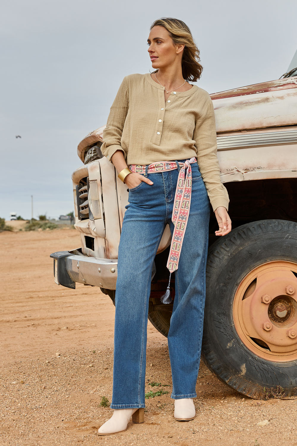 Model Tegan wearing size 10 of the Pleased To Meet You Jeans in colour Denim (Blue), from the front, showing the whole outfit