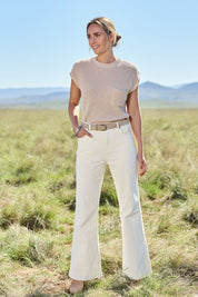 Model Tegan wearing size 10 of the Forever Cool Cord Jeans in colour Milk (White), from the front, showing the whole outfit
