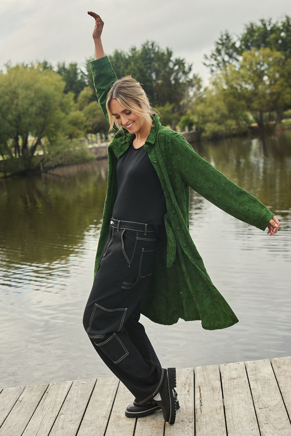 Model Tegan wearing size 10 of the Carry Me With You Cargo Jeans in colour Black (Black), from the front, showing the whole outfit