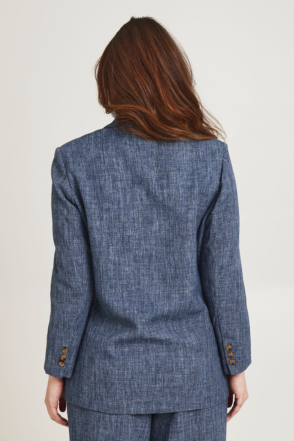 Model Jane wearing size 14 of the Blazing Trails Blazer in colour Duskblue (Blue), from the back