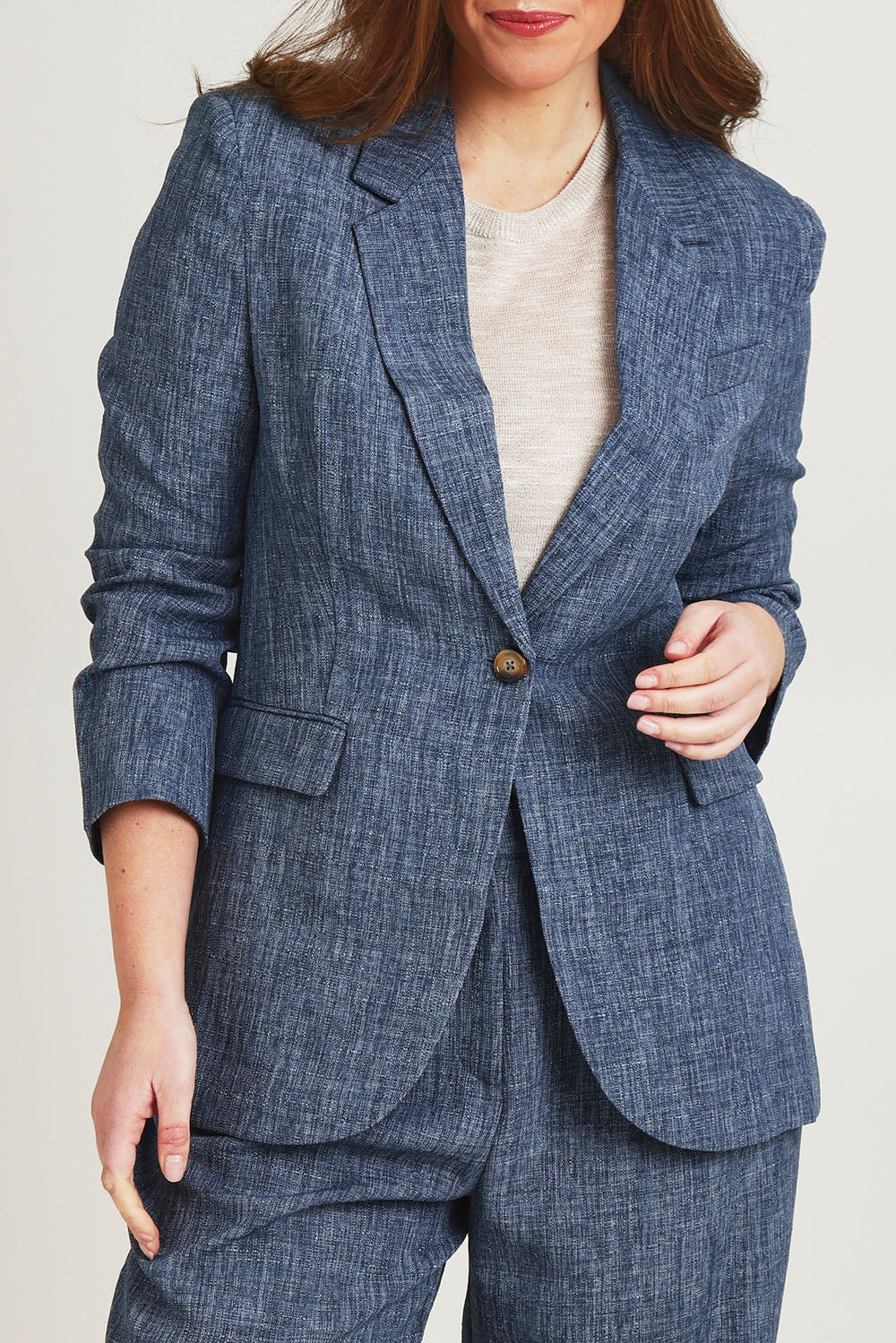 Model Jane wearing size 14 of the Blazing Trails Blazer in colour Duskblue (Blue), from the front, cropped image
