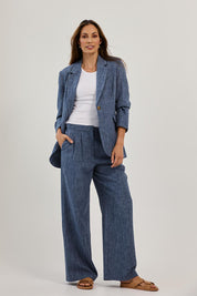 Model Amanda wearing size 10 of the Blazing Trails Pants in colour Duskblue (Blue), from the front, showing the whole outfit