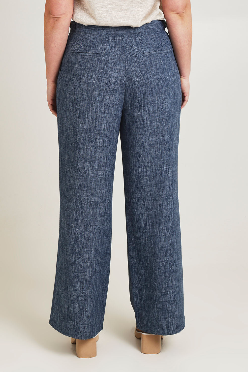 Model Jane wearing size 14 of the Blazing Trails Pants in colour Duskblue (Blue), from the back