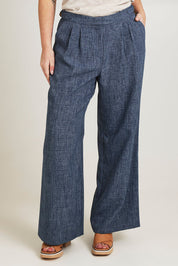 Model Jane wearing size 14 of the Blazing Trails Pants in colour Duskblue (Blue), from the front, cropped image