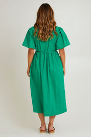 Model Laura wearing size 14 of the Lunch With The Girls Wrap Dress in colour Emerald (Green), from the back