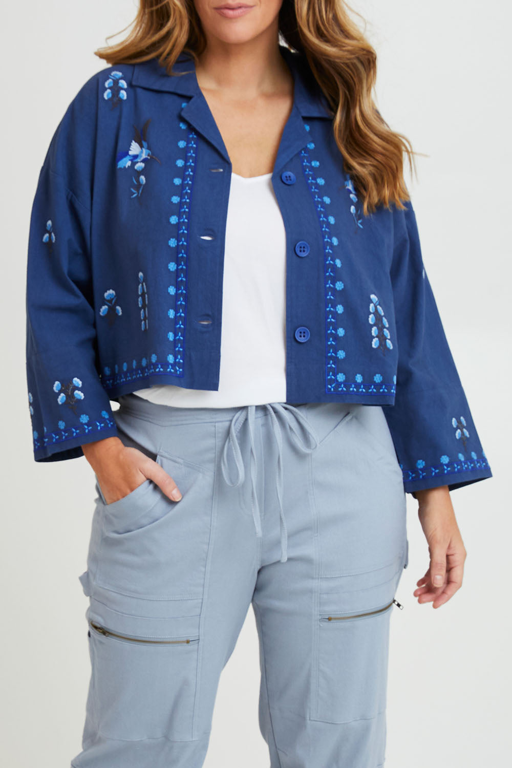 Model Laura wearing size 14 of the Come Away With Me Embroidered Jacket in colour Bluehue (Blue), from the front, cropped image