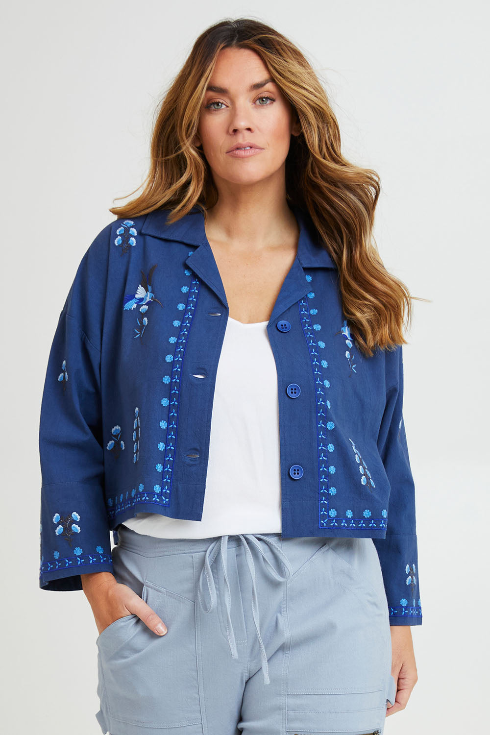 Model Laura wearing size 14 of the Come Away With Me Embroidered Jacket in colour Bluehue (Blue), from the front, cropped image