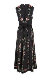 Product shot of the Fleur Muse Embroidered Dress – Black in colour Black, from the back