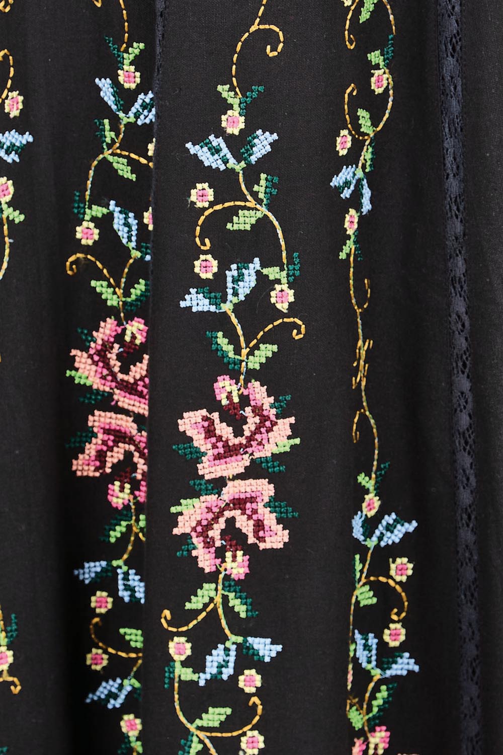 Product shot of the Fleur Muse Embroidered Dress – Black in colour Black, showing detail